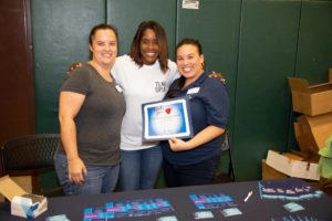 Lisa and Erin with Commissioner Siplin at a back to school event.